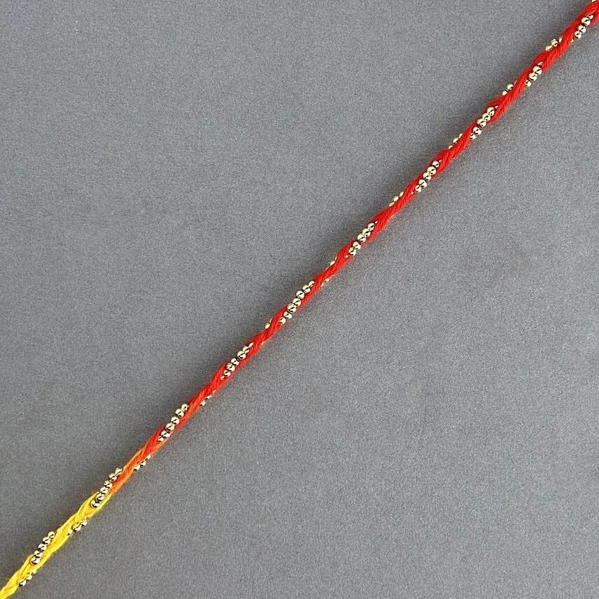 Sacred Bead Work Mauli Rakhi And 16 Pcs Ferrero Rocher: Rakhi in Ajman