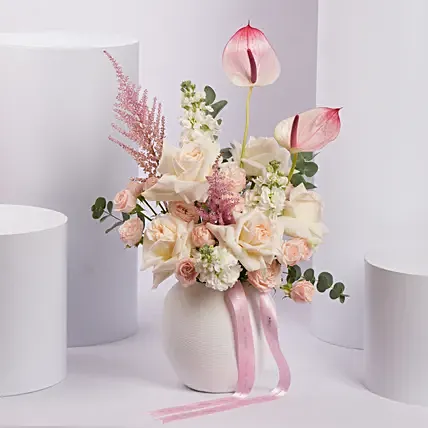 Pink and White Flower Arrangement in White Ceramic Vase: Anniversary Gifts