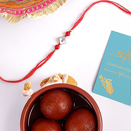 Red Thread Square Design Rakhi And Gulab Jamun: Rakhi to Al Ain