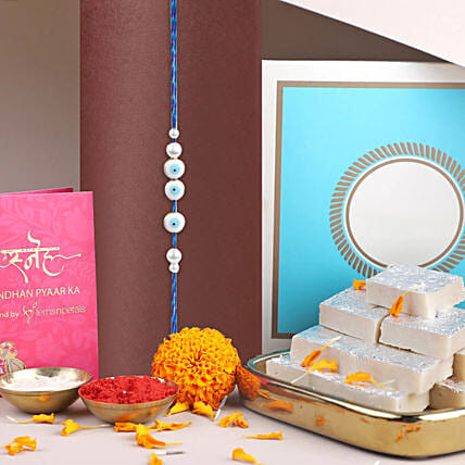 Simplistic Blue Evil Eye Rakhi N Kaju Katli: Rakhi with Sweets