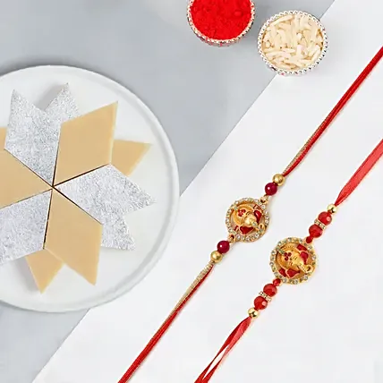 Ganesha Rakhi Set Of 2 With Kaju Katli: Rakhi for Bhaiya Bhabhi
