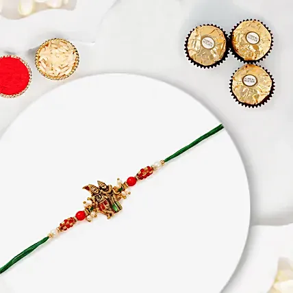 Sneh Gold Radha Krishna Pearl Rakhi With 3 Pcs Ferrero Rocher: Pearl Rakhi