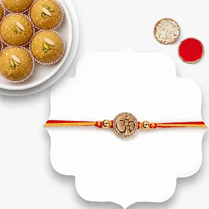 Gold Om Mauli Rakhi With Besan Laddoo: Mauli Rakhi 