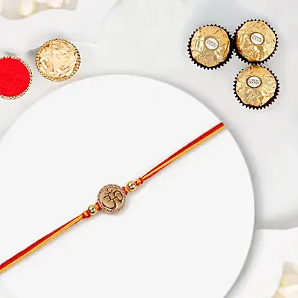 Gold Om Mauli Rakhi With Ferrero Rocher 3 Pcs: Rakhi With Chocolates