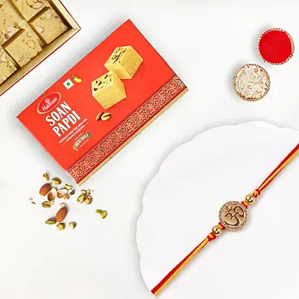 Gold Om Mauli Rakhi With Soan Papdi: Mauli Rakhi