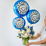 Blue and White Flower Arrangement With Balloons