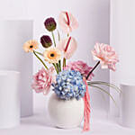 Colorful Flower Arrangement in White Vase