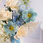 Elegant Blue and White Flower Arrangement in Ceramic Vase