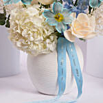 Elegant Blue and White Flower Arrangement in Ceramic Vase