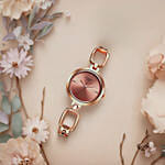 Titan Raga Rose Gold Dial Watch for Her Elegant Gift in a Glass Vase With Flowers