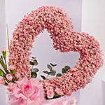 بوكس زهور وردية على شكل قلب للأم