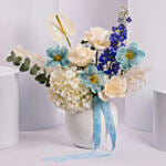 Elegant Blue and White Flower Arrangement in Ceramic Vase