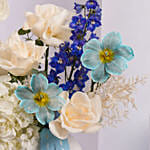 Elegant Blue and White Flower Arrangement in Ceramic Vase