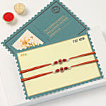 Red Pearl Rakhi Set Of 2 With 6 Raksha Bandhan Cupcakes