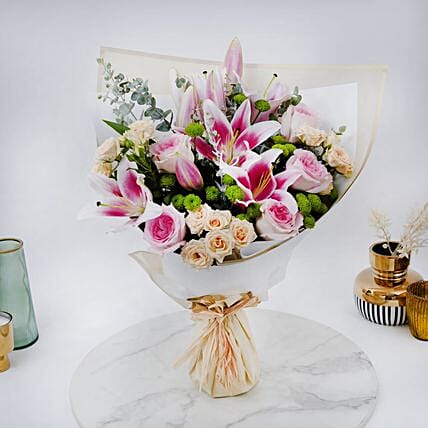 Pink Roses And Lily Bouquet In White Wrapper: توصيل ورد في السعودية