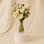A Bouquet Of White Roses With Cake For Eid Al Adha
