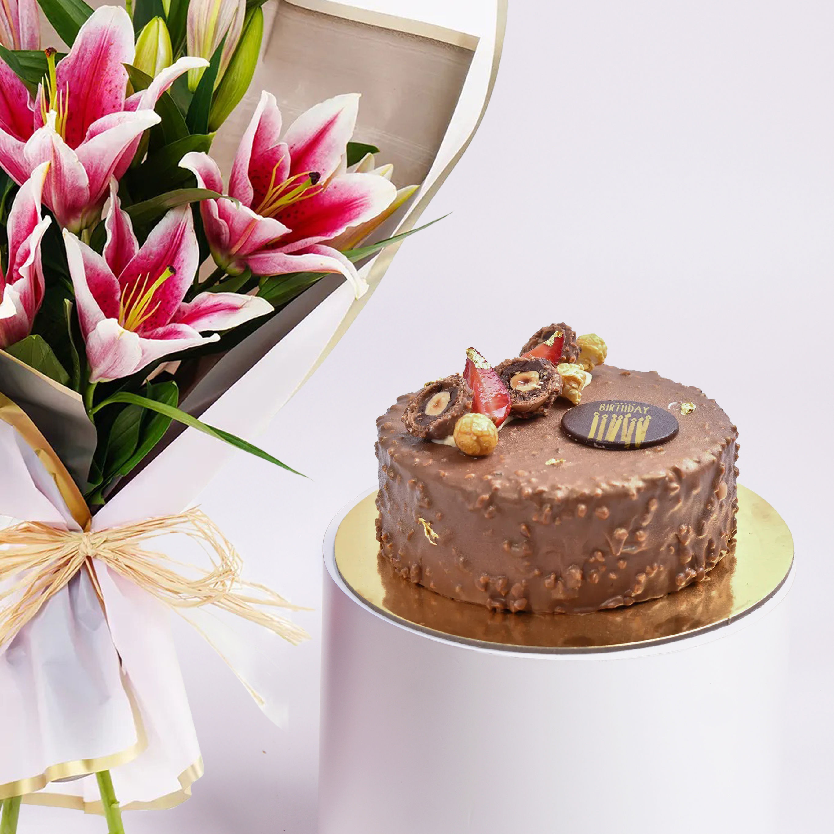 Order Pink Lilies Elegance Bouquet With Rocher Cake Online | Same-Day ...